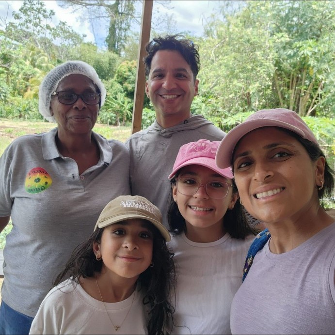 Theresa welcoming a family with children to the farm